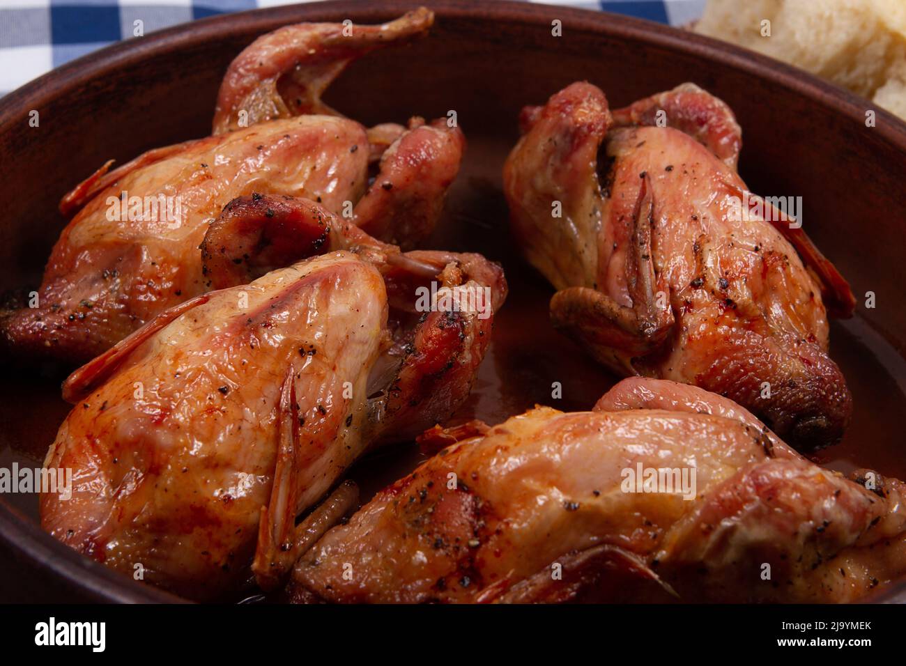 Roasted quail  with Golden brown crispy crust. Close-up. Stock Photo