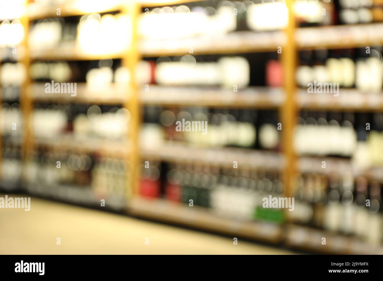 Blurred photo of alcohol department with different drinks Stock Photo