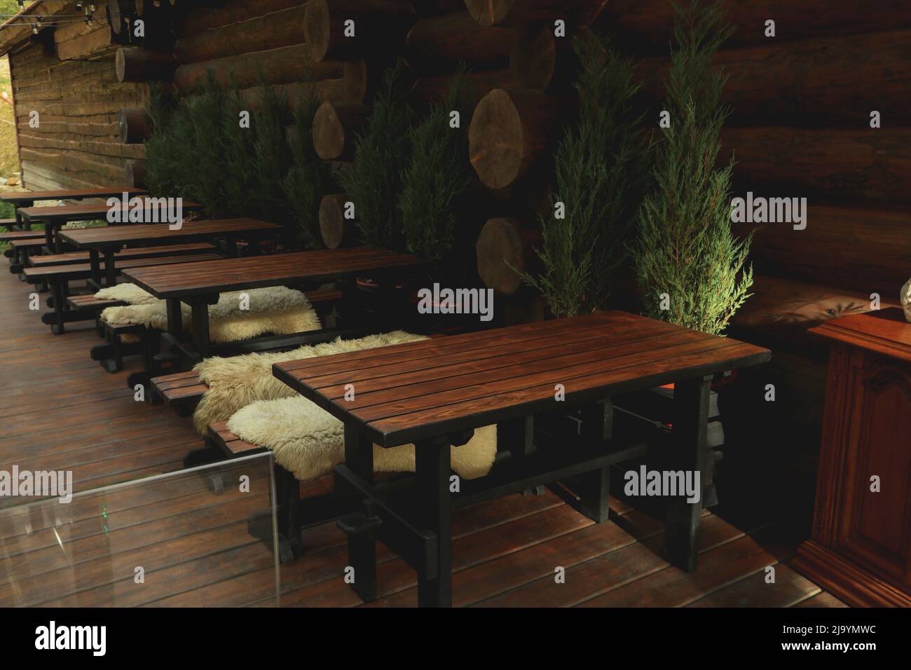 Cozy restaurant with outdoor tables in mountain resort Stock Photo