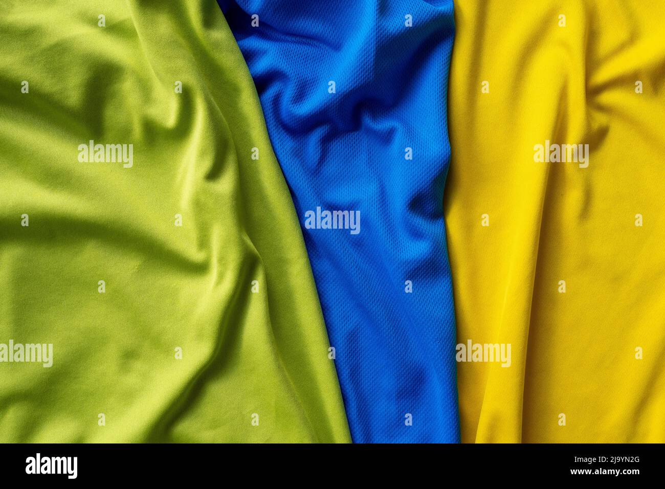 Three polyester, nylon folded sport shirts, top view Stock Photo