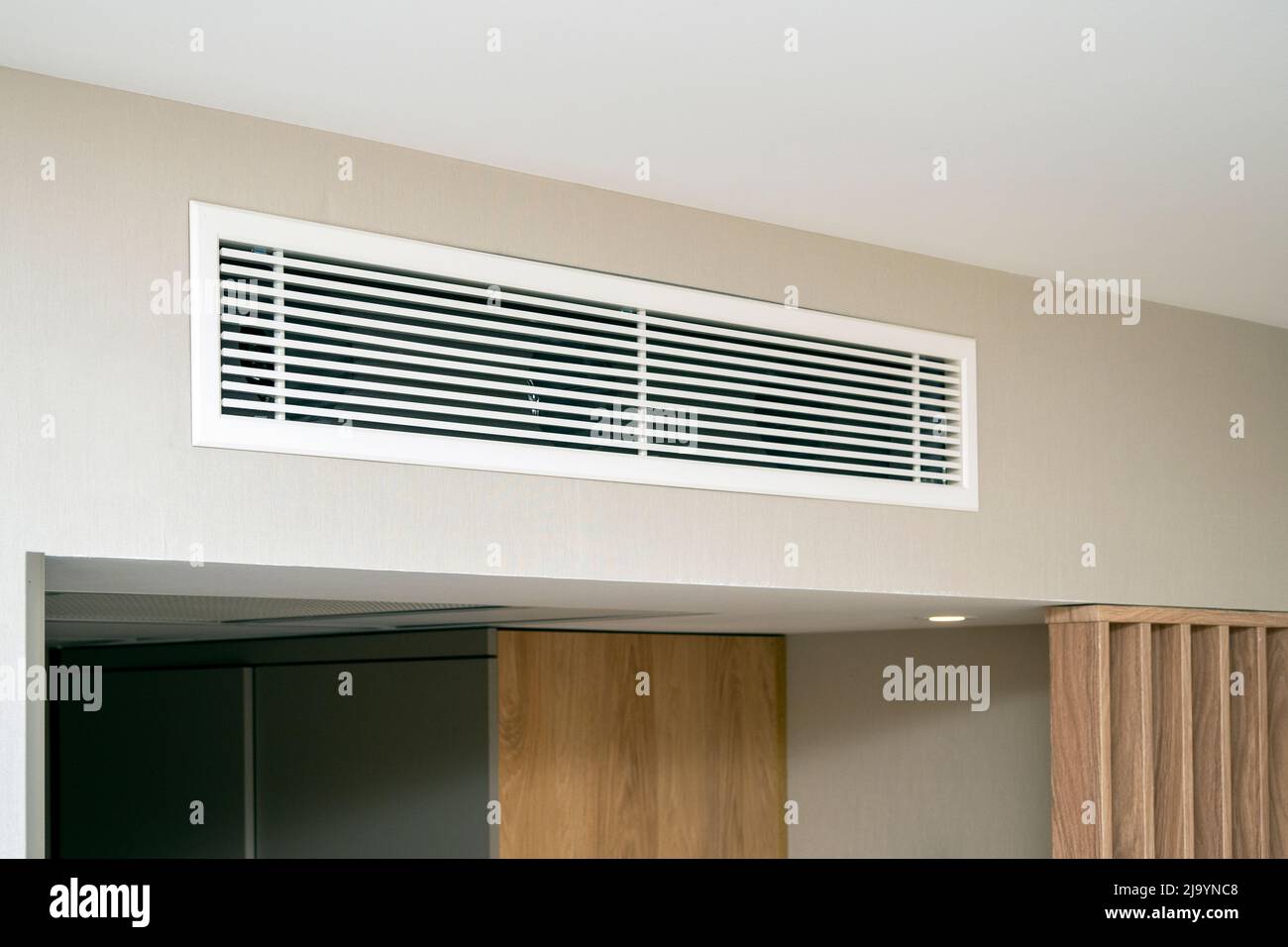 Clean modern air condition, air conditioner system at a room in hotel Stock Photo