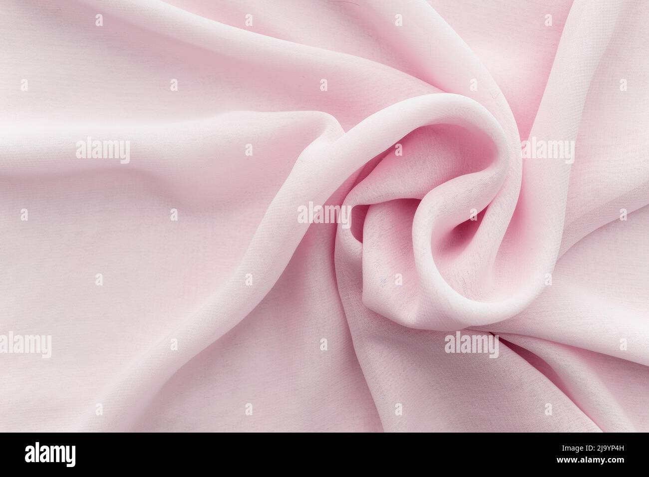Wavy twisted pink fabric Stock Photo