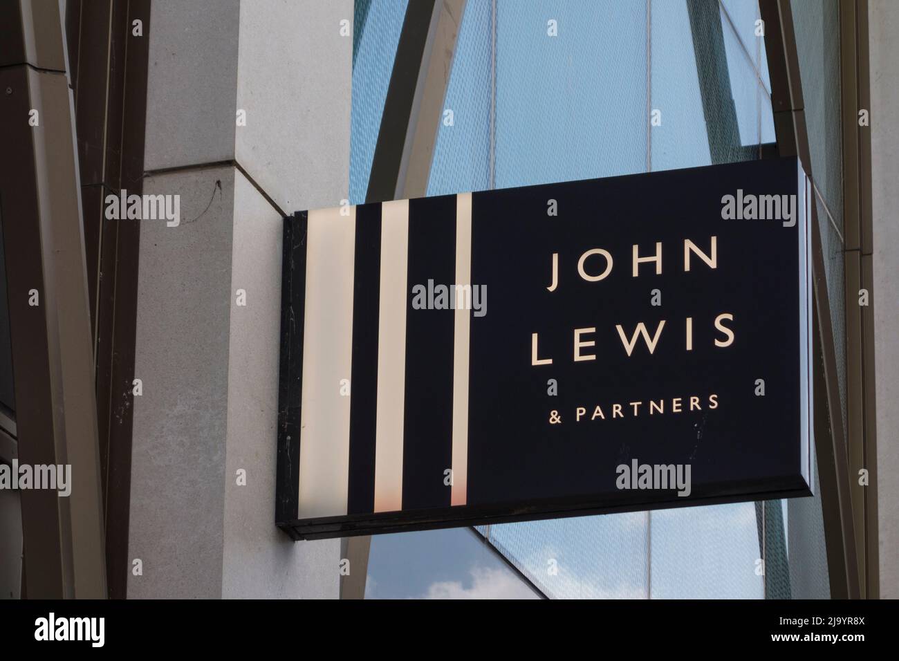 John Lewis & Partners sign on facade of building, Cheltenham, Gloucestershire, UK Stock Photo