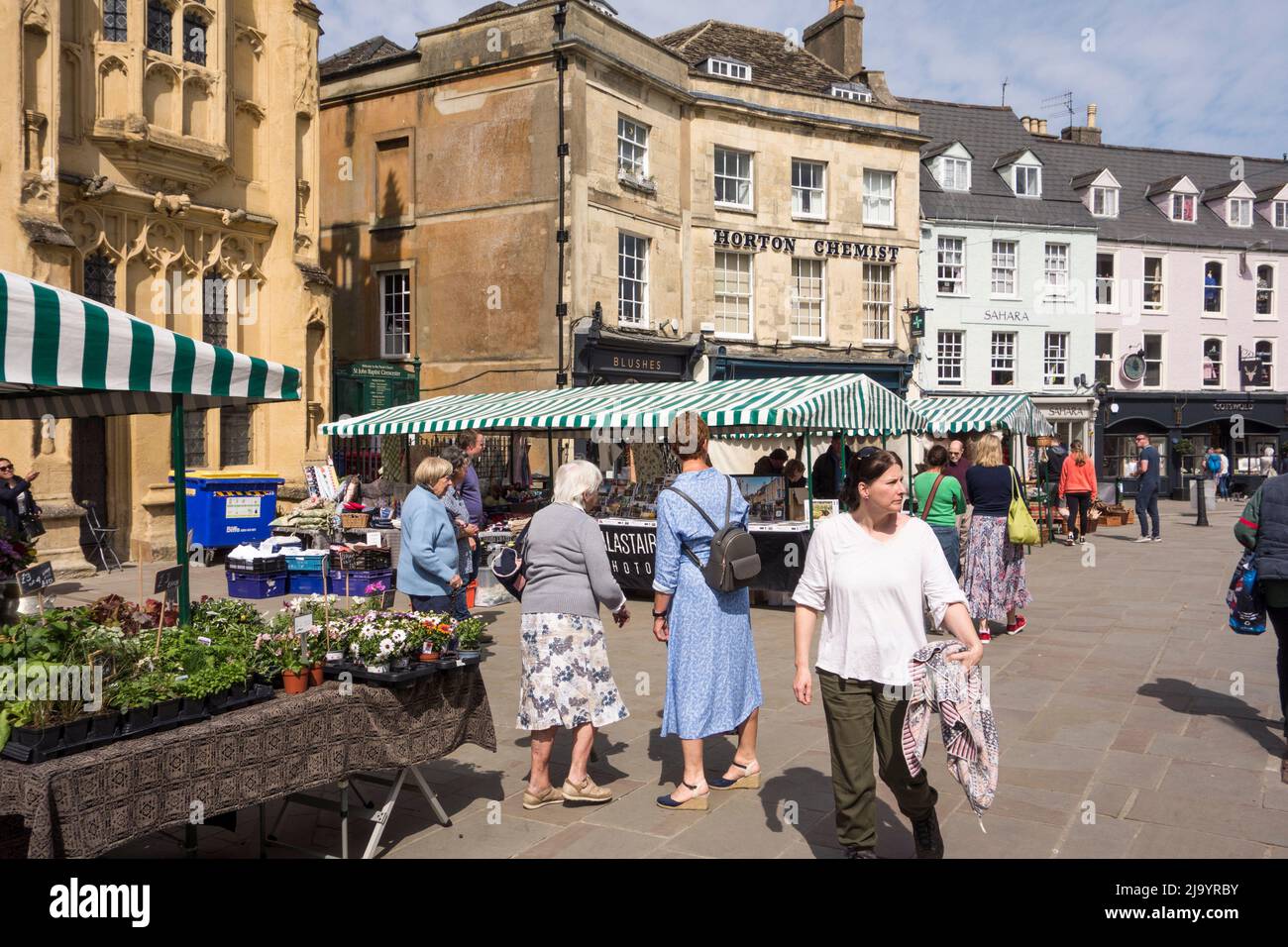 Shoppers at Saturday outdoor market in Market Place, Cirencester, Gloucestershire, UK Stock Photo