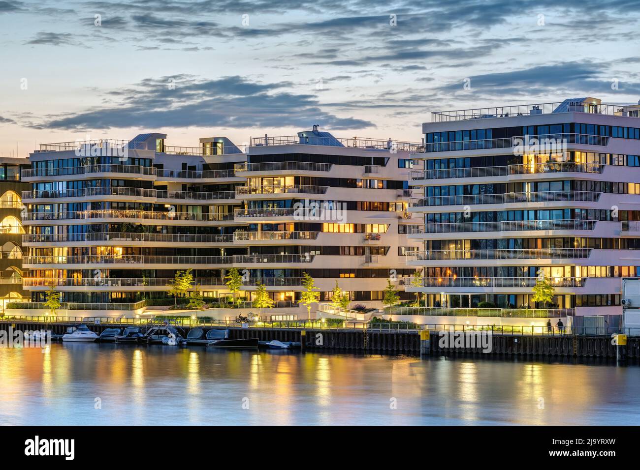 Modern apartment buildings at the river Spree in Berlin at dusk Stock Photo