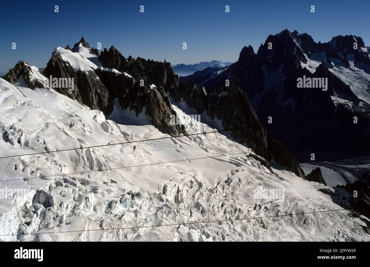 View from a gondola of the Panoramic Mont-Blanc to Pointe Helbronner on the crevassed surface of the glaciers of the Vallee Blanche. Chamonix, 1990 Stock Photo