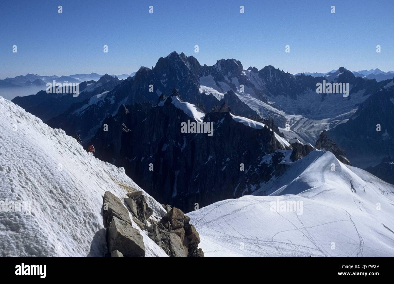 View from the Aiguille du Midi over firn fields with the tracks of many mountaineers towards the Glacier de Talèfre. Chamonix Mont Blanc, France, 1990 Stock Photo