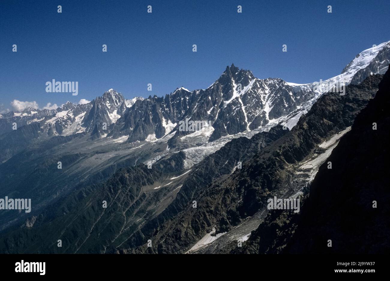 Mont Blanc massif with Aiguille du Midi, Glacier des Bossons and Aiguilles de Chamonix seen near Nid d'Aigle, Saint-Gervais-les-Bains, France, 1990 Stock Photo