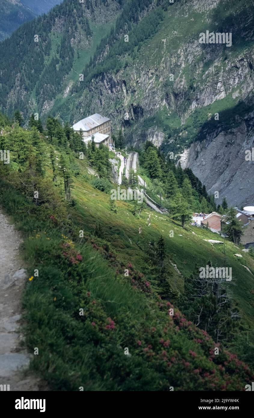 The Montenvers viewpoint with the Grand Hôtel du Montenvers seen from the Plan d'Aiguille to Montenvers hiking trail, Chamonix-Mont-Blanc, France,1990 Stock Photo