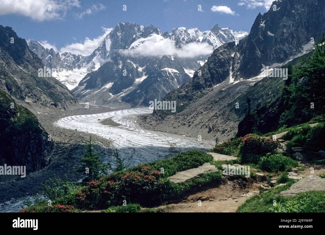 Mer de Glace glacier with mountains of the Mont Blanc massif seen from the hiking trail from Plan d'Aiguille to Montenvers. Chamonix, France, 1990 Stock Photo