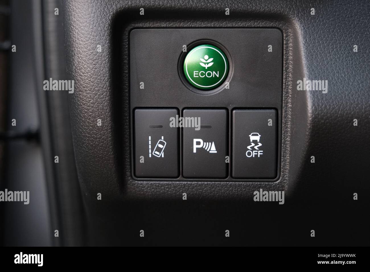 Economic mode button, lane keep assist, parking assist and electronic stability programme (esp) button inside car Stock Photo