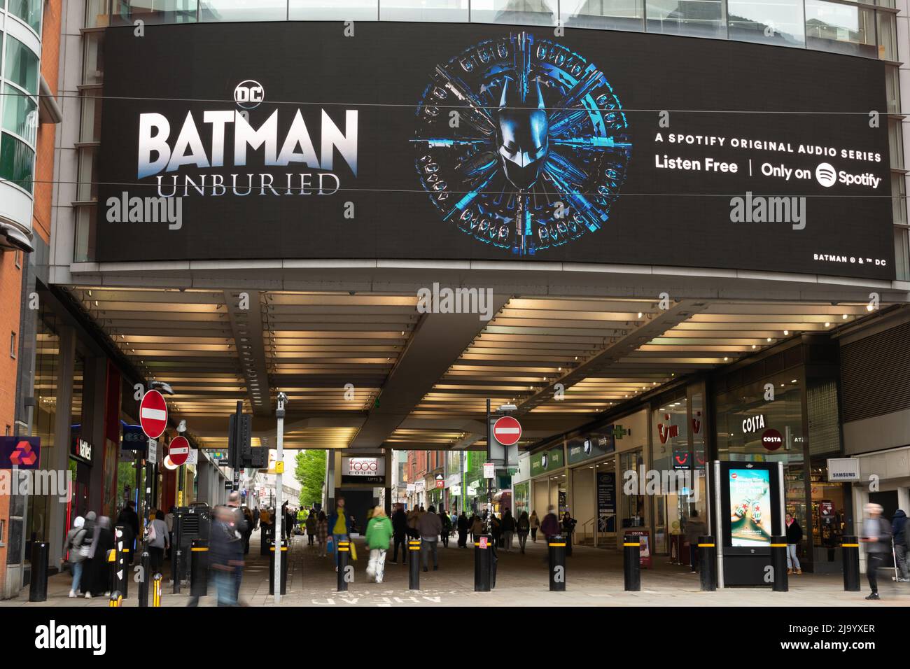 Advert for Batman unburied on Spotify. Display screen Manchester Arndale UK. Long exposure. Stock Photo