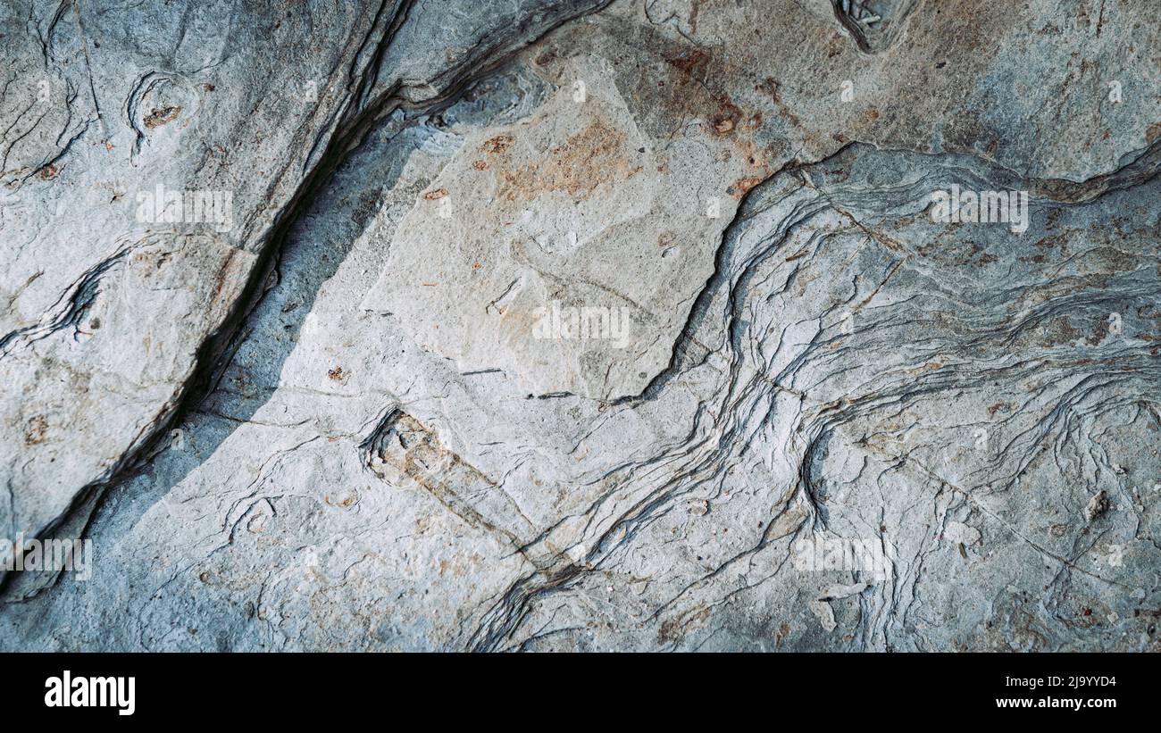 Rocky wall with uneven surface. Panaroramic Stock Photo