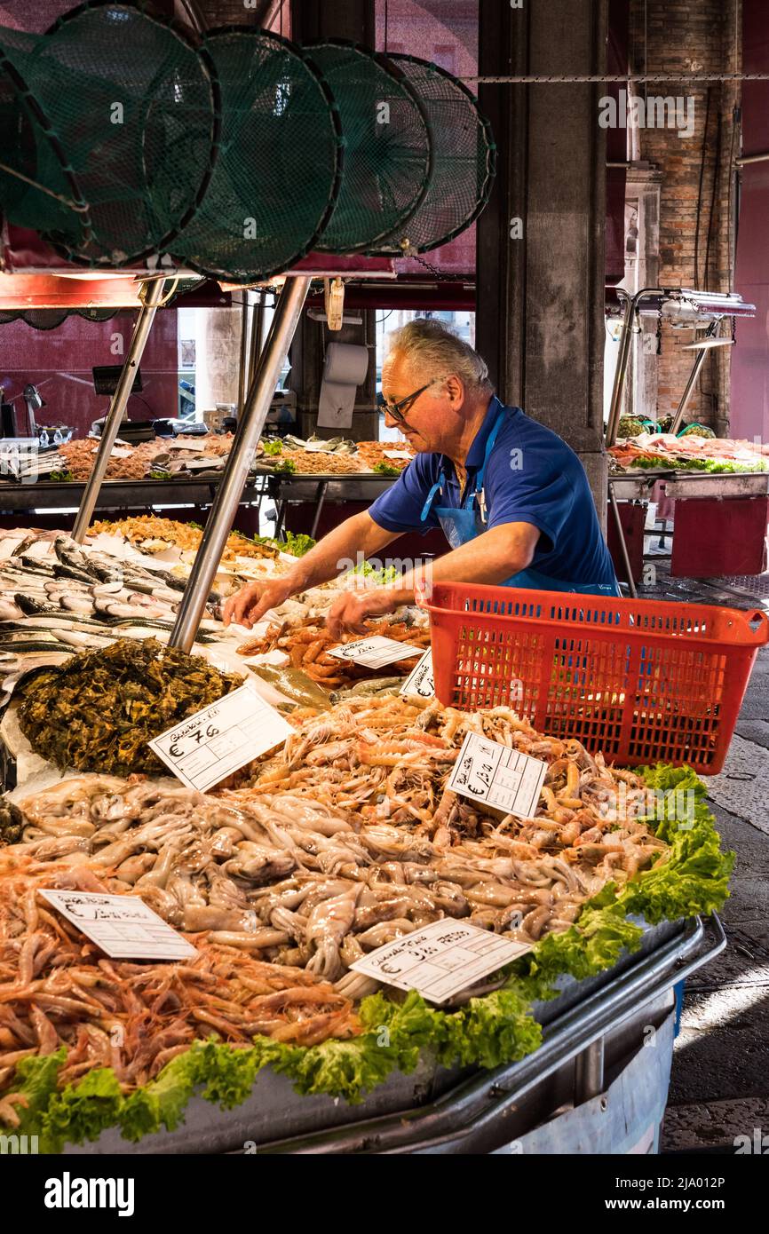Fishmonger's staff at Rialto Fish Market, Venice, Italy Stock Photo