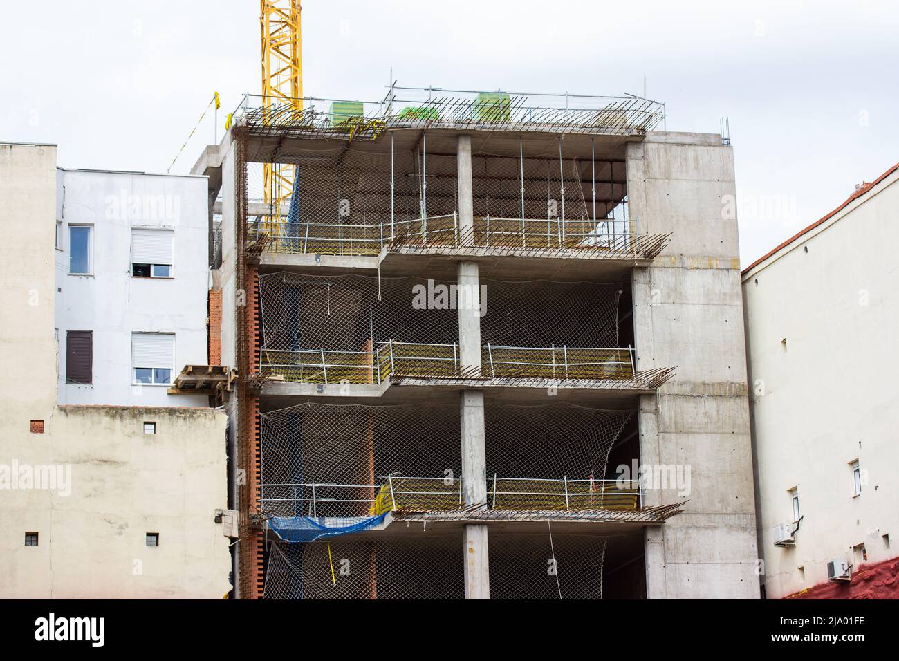 The facade of a residential multistory panel building that is being ...