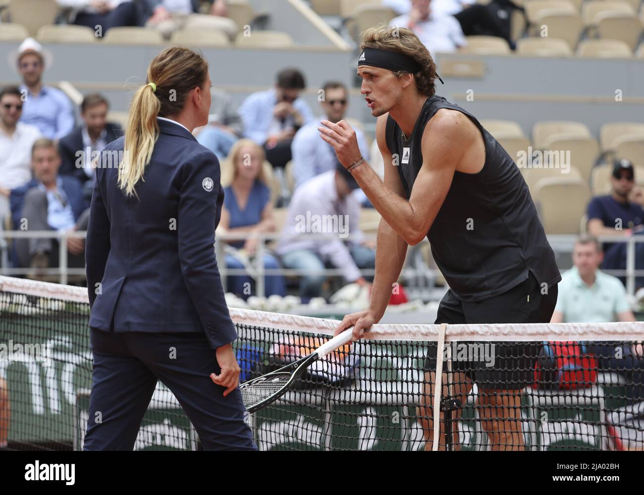 Alexander Zverev of Germany argues with the chair umpire during day 4