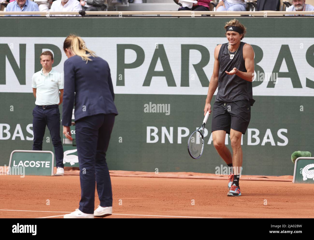 Alexander Zverev of Germany argues with the chair umpire during day 4
