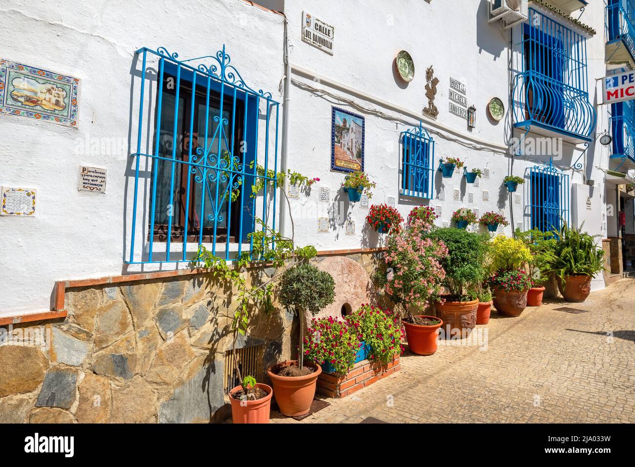 View to typical pedestrian street with picturesque facades in Torremolinos. Andalusia, Spain Stock Photo