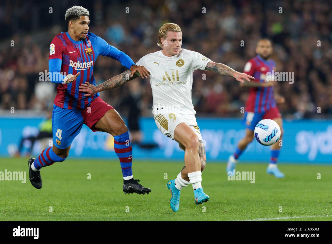 Sydney, Australia. 25th May, 2022. Jason Cummings of the All Stars is challenged by Ronald Araujo of FC Barcelona during the match between FC Barcelona and the A-League All Stars at Accor Stadium on May 25, 2022 in Sydney, Australia Credit: IOIO IMAGES/Alamy Live News Stock Photo