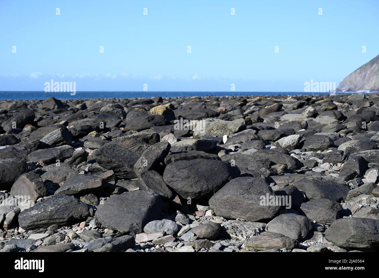 Rocks, stones on the Devon beach during a sunny day Stock Photo