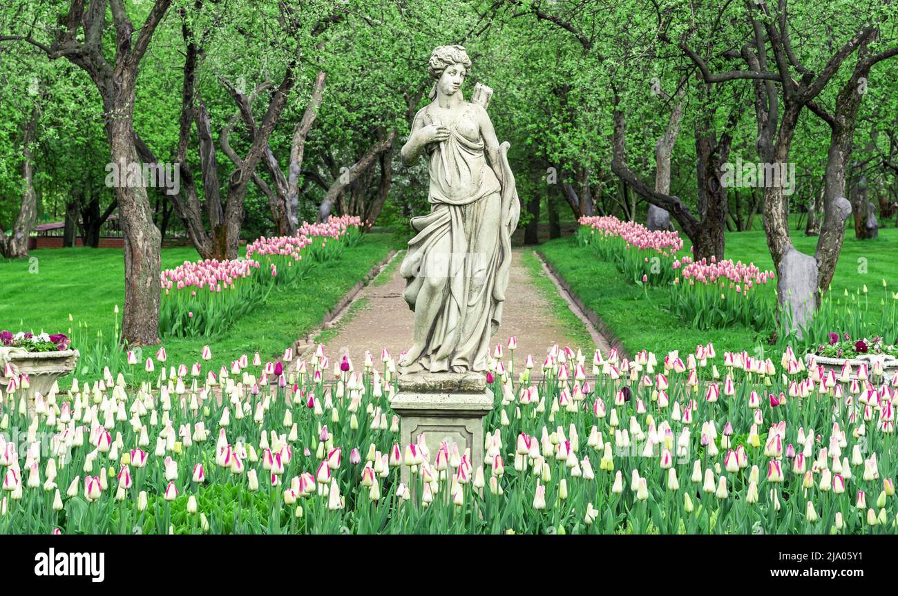 Sculpture of the ancient Greek goddess Artemis in the apple orchard of