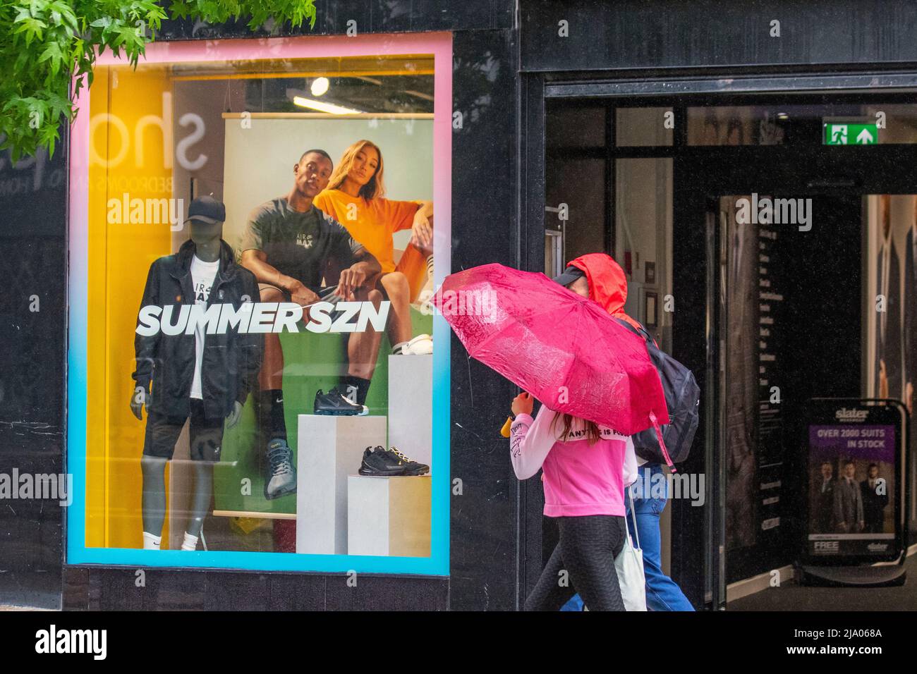 Preston, Lancashire.  UK Weather 26 May 2022.  No signs of summer seasson as yet another rainy start to the day for shops, shoppers and shopping in Preston. A dull and wet start to today, with spells of rain moving in.  Credit. MediaWorldImages/AlamyLiveNews Stock Photo