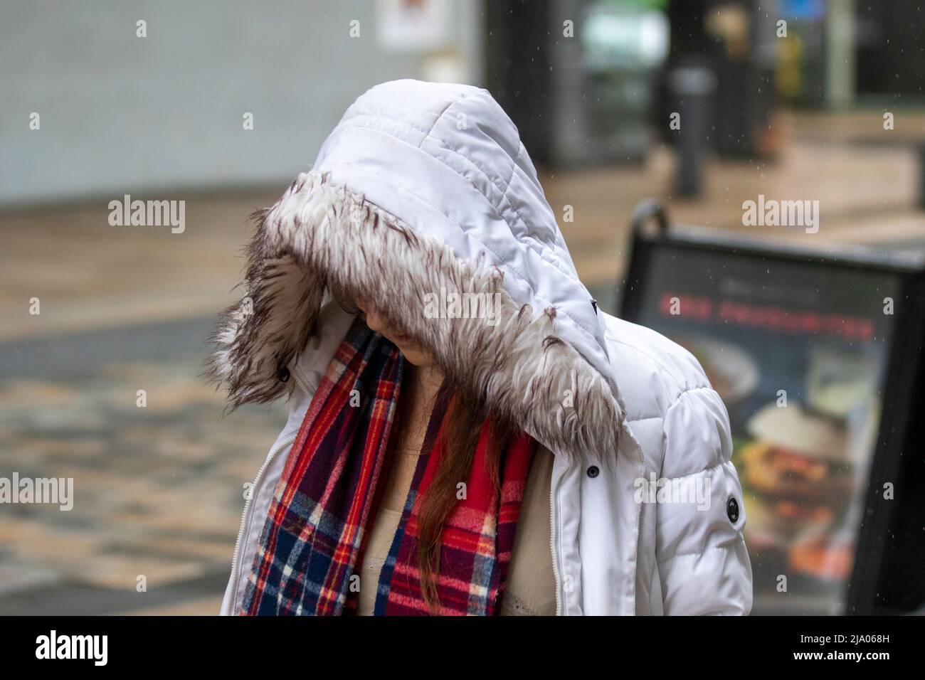 Preston, Lancashire.  UK Weather 26 May 2022.  No signs of summer as yet another rainy start to the day for shops, shoppers and shopping in Preston.  A dull and wet start to today, with spells of rain moving in. Credit. MediaWorldImages/AlamyLiveNews Stock Photo