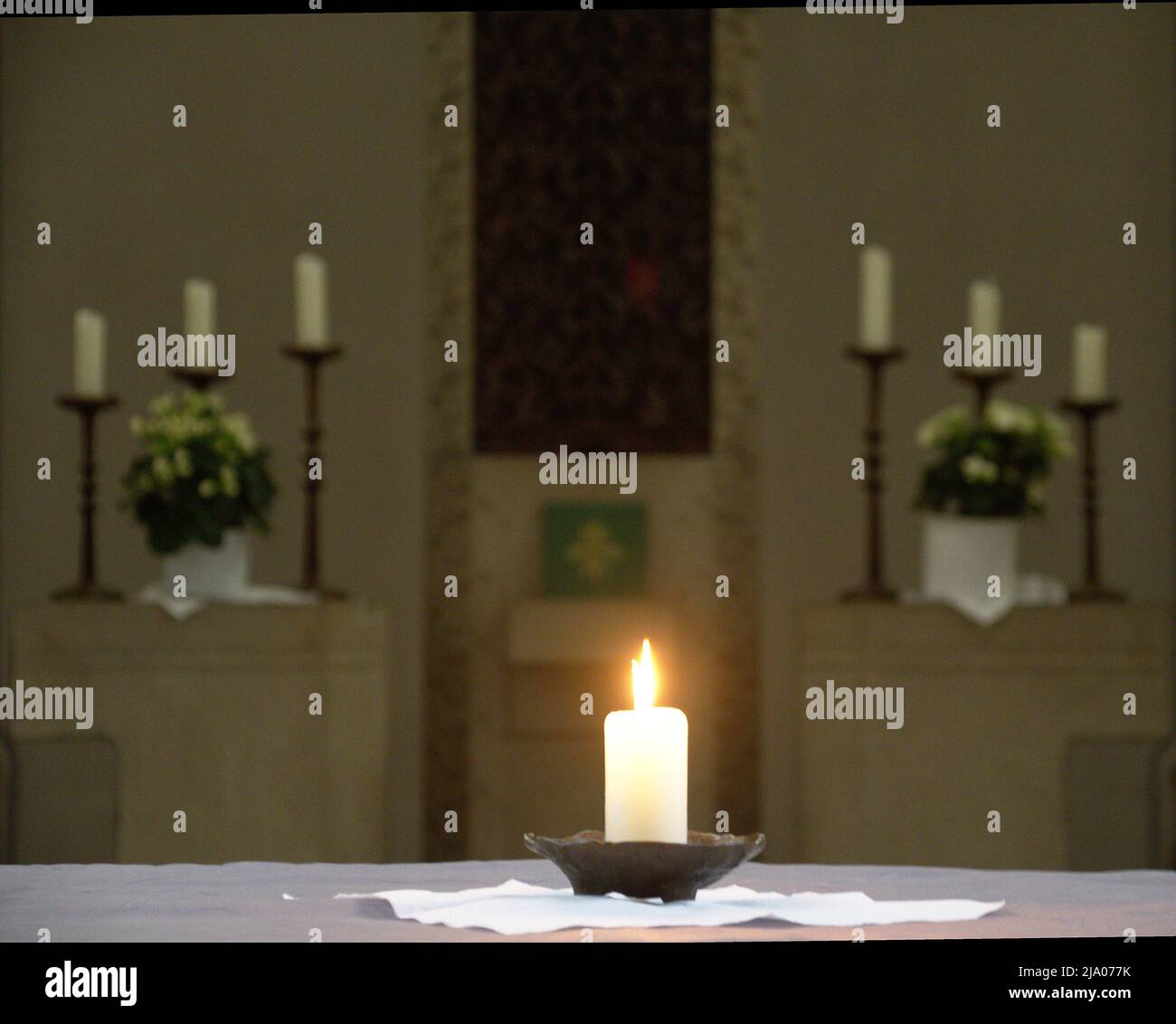 Candle burns in a church candlestick light flame Stock Photo Alamy