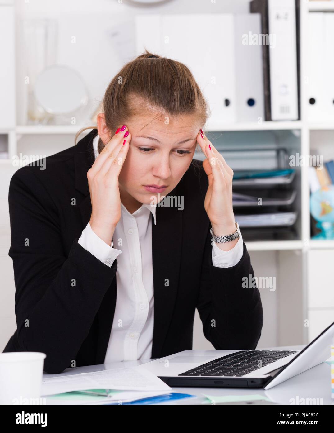 Office manager woman is having complicated issue with project Stock