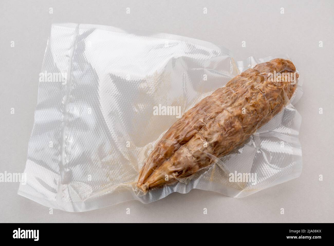 Italian salami in vacuum packed sealed for sous vide cooking isolated
