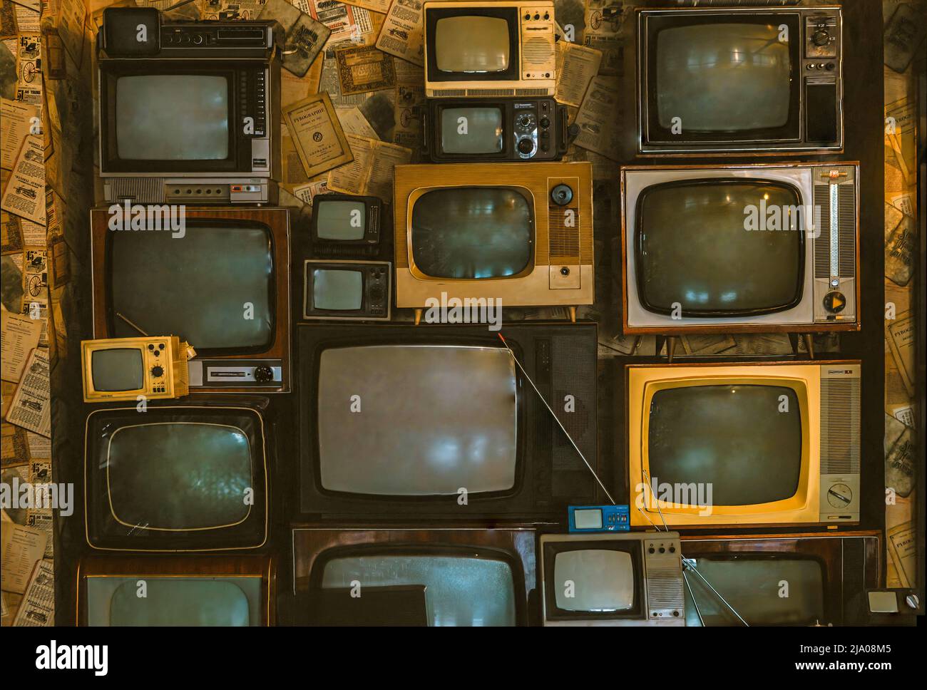 wall of pile colorful retro television. Old TV, vintage style. Stock Photo