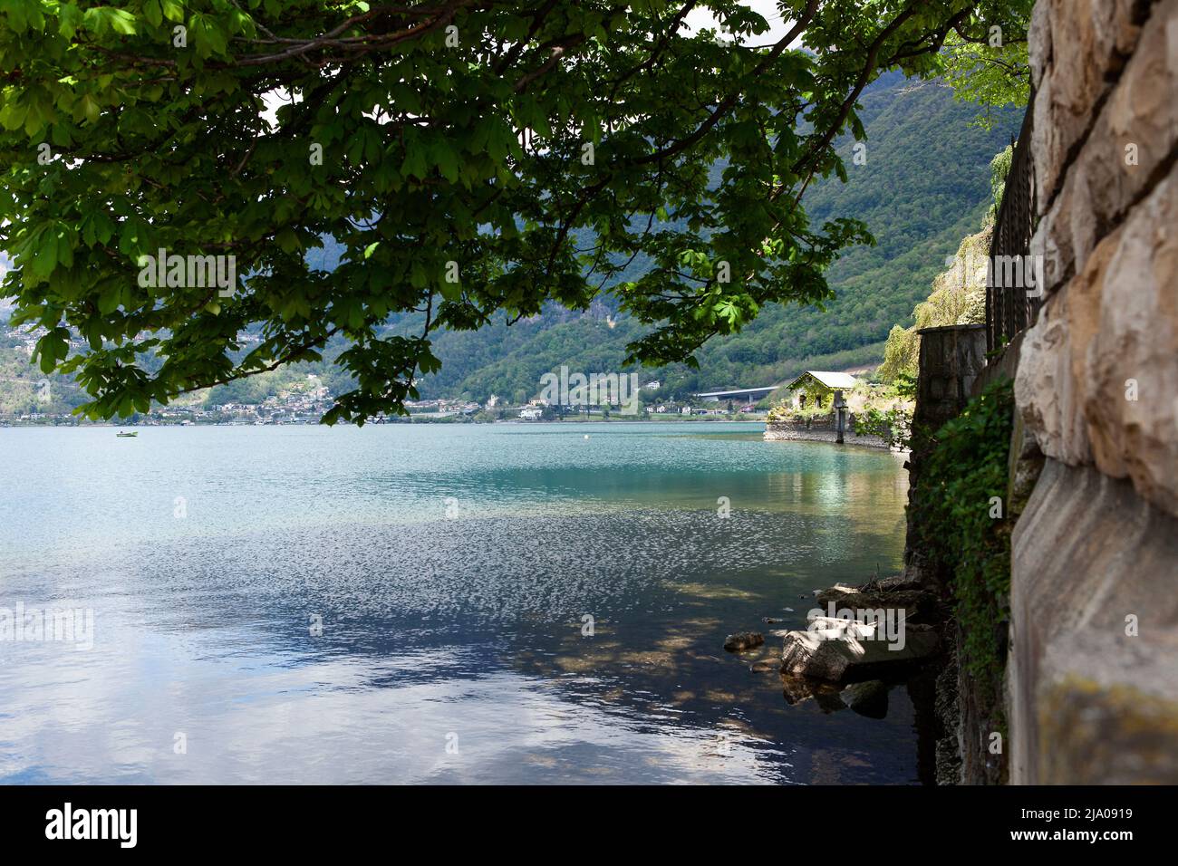 A quiet lookout along the shore of the Capolago Lake Stock Photo