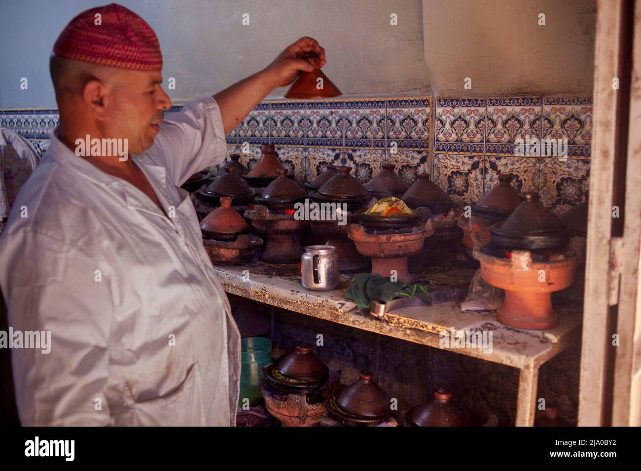 Tajine kitchen restaurant nearby Ferbantiers square. Daily life scene in the traditional Medina and zoco streets of Marrakesh, Morocco. Stock Photo