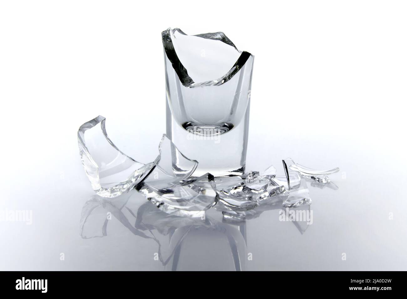Shards of a broken glass goblet on a white background Stock Photo - Alamy