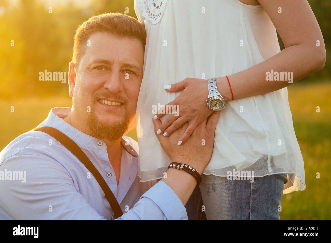 nice happy husband hugging his pregnant wife Stock Photo - Alamy