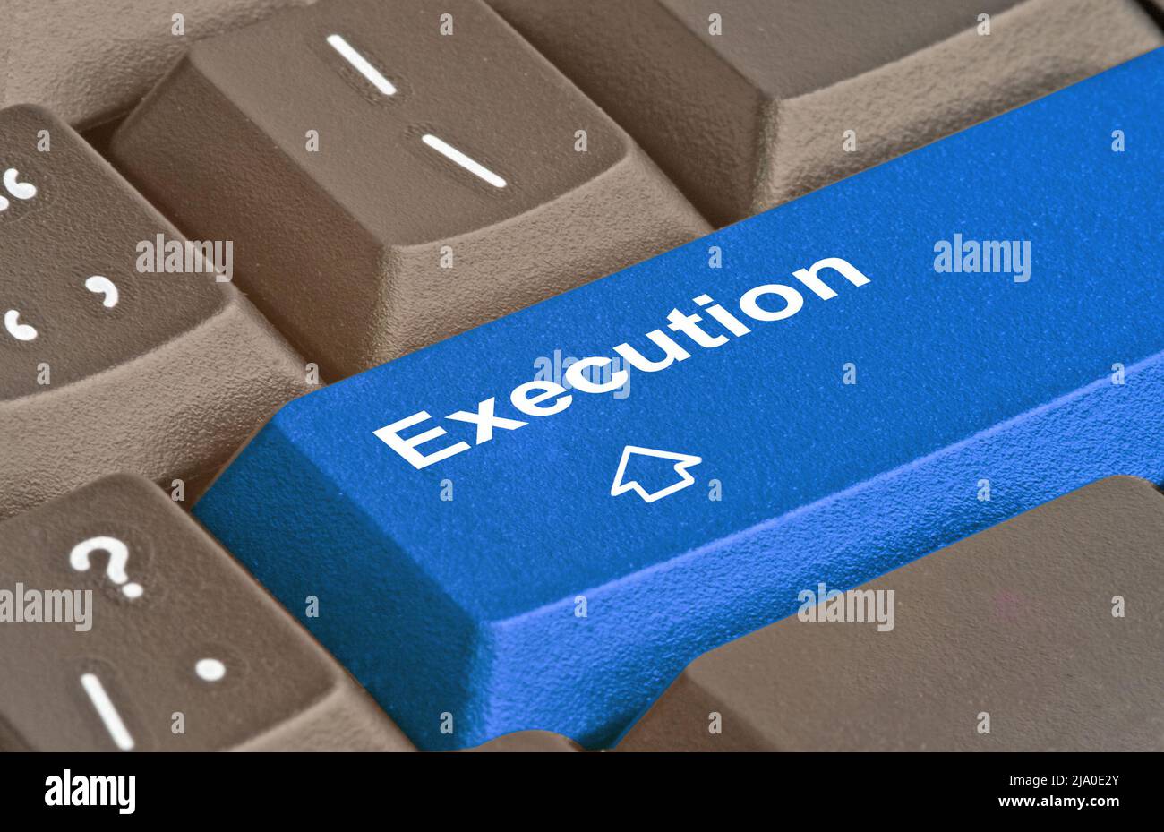 Hot blue key for execution Stock Photo - Alamy