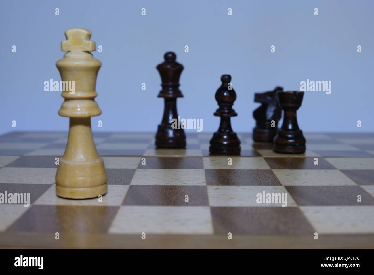 Chess pieces on a chessboard - Focus on the King Stock Photo - Alamy