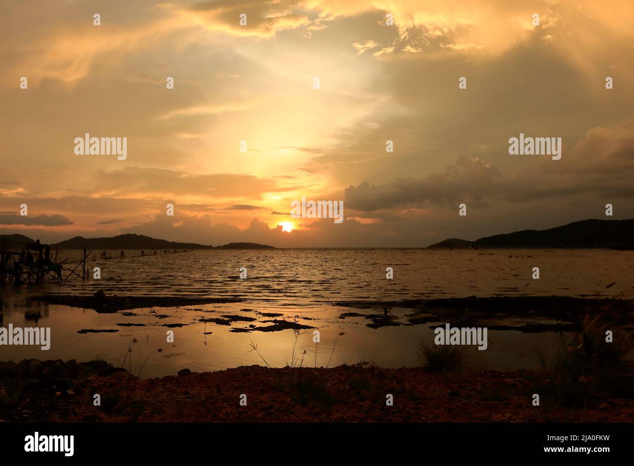 photograph of the sunset from the sea and the beautiful sky twilights ...