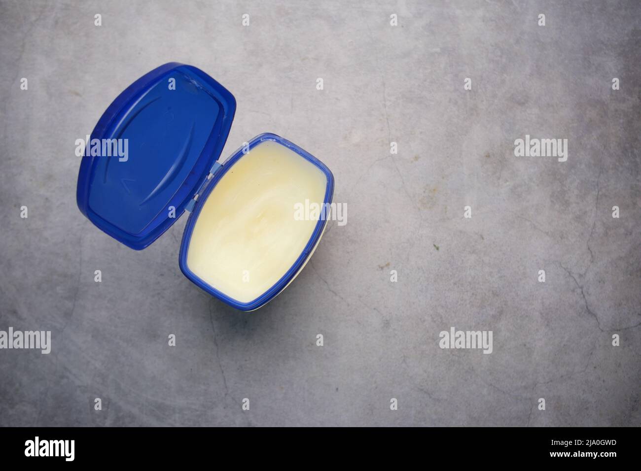 top view of petroleum jelly in a container on black background  Stock Photo