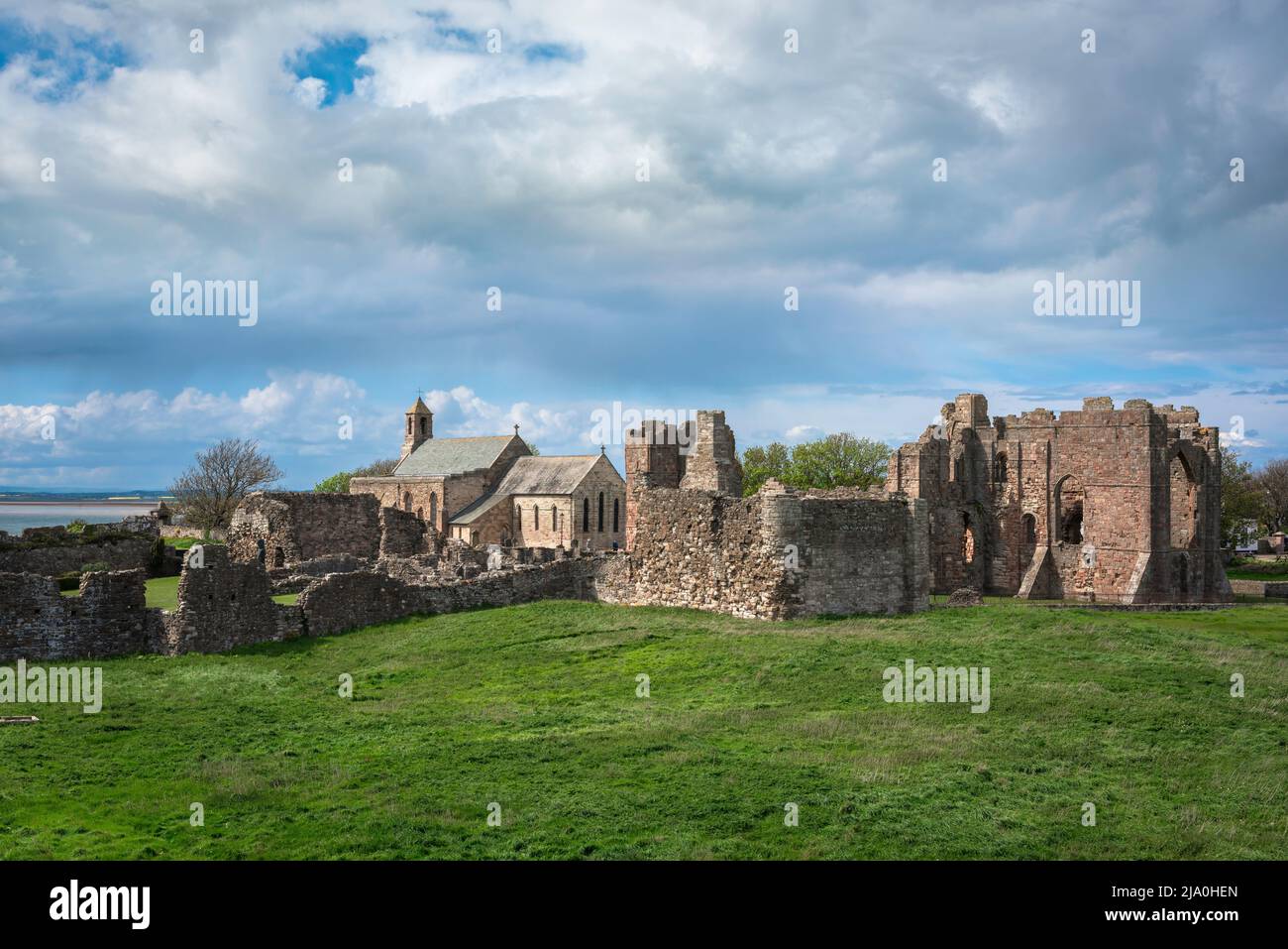 Ruins UK, view of the ruins of Lindisfarne Priory dating from the early 12th Century, Holy Island, Northumberland coast, England, UK Stock Photo