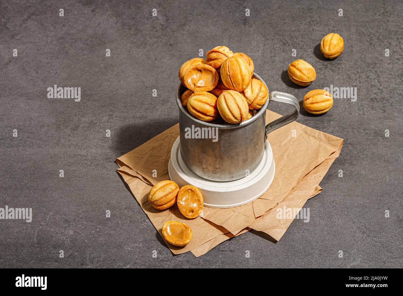 Cookies in the shape of walnuts with condensed milk cream filling