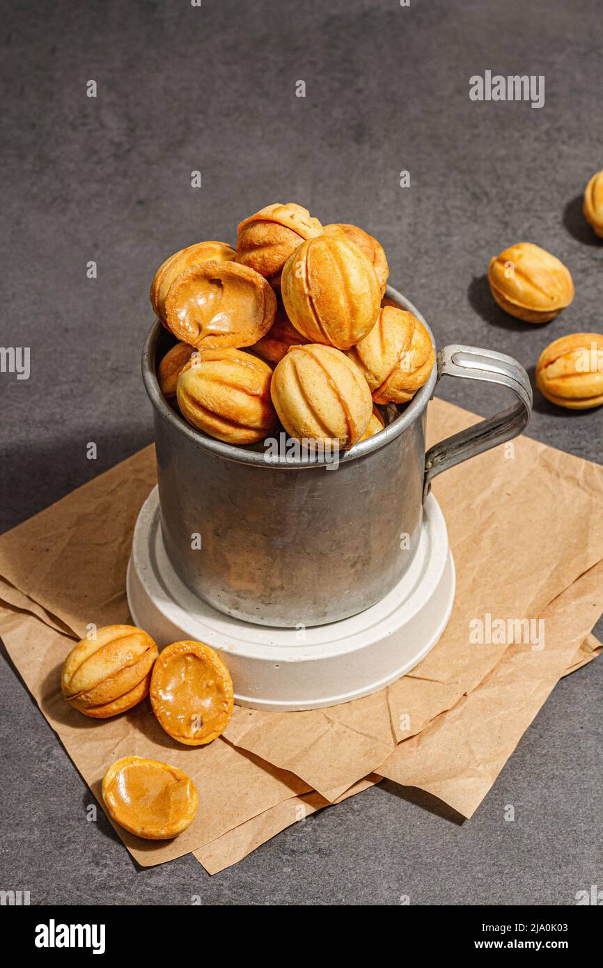 Cookies in the shape of walnuts with condensed milk cream filling