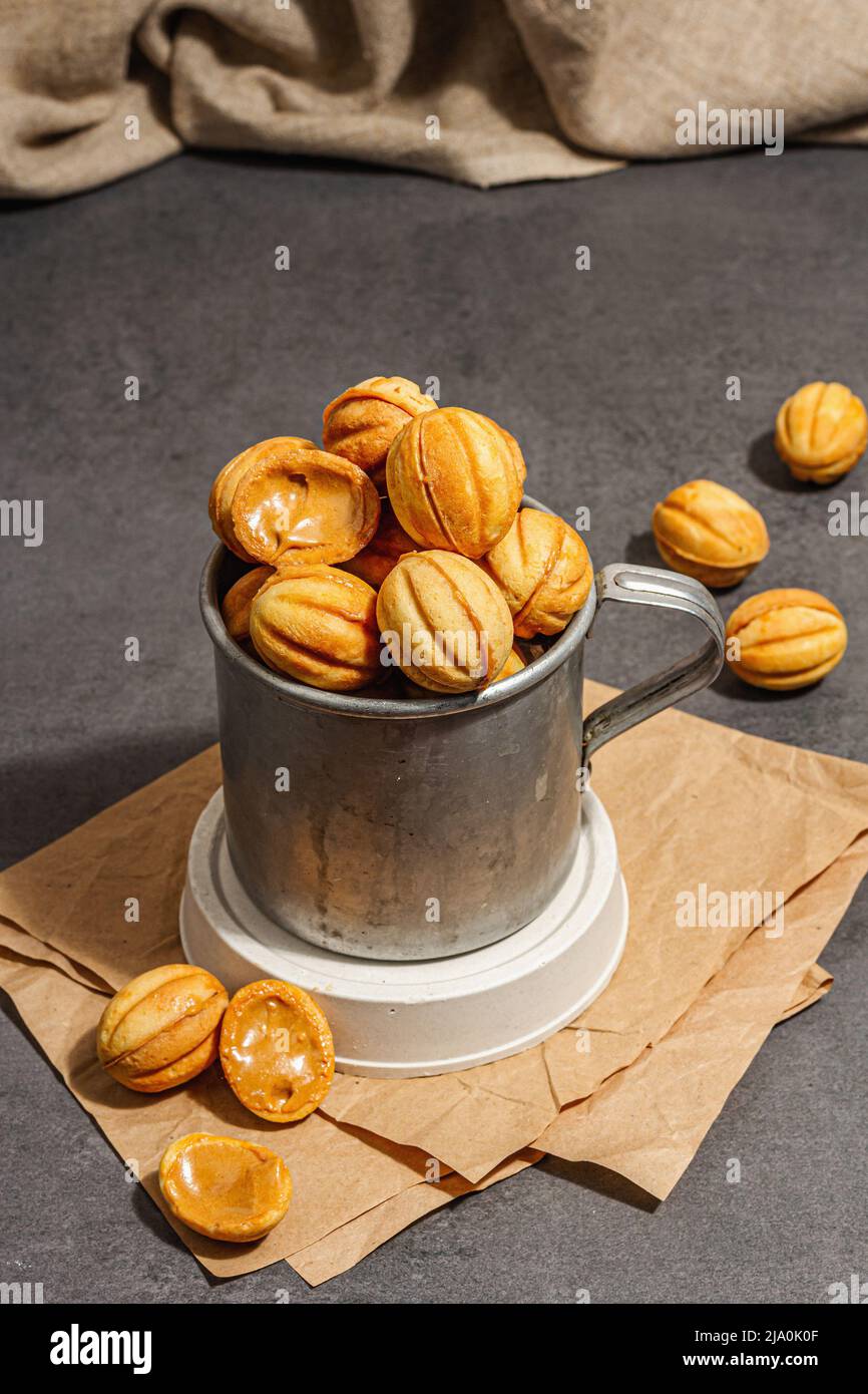 Cookies in the shape of walnuts with condensed milk cream filling