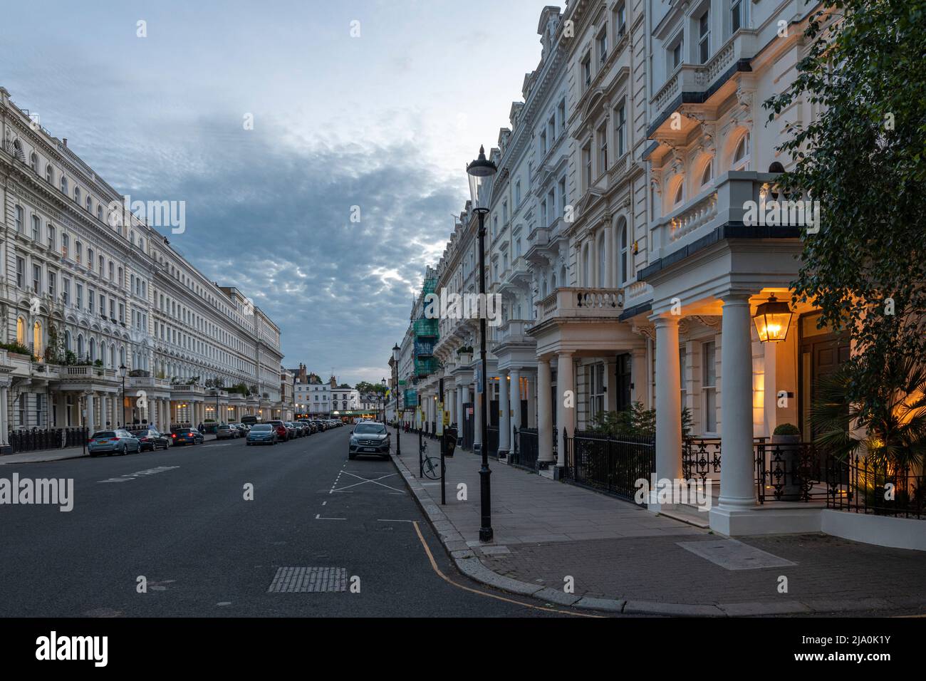 Looking West along Queen's Gate at dusk, London SW7. Stock Photo