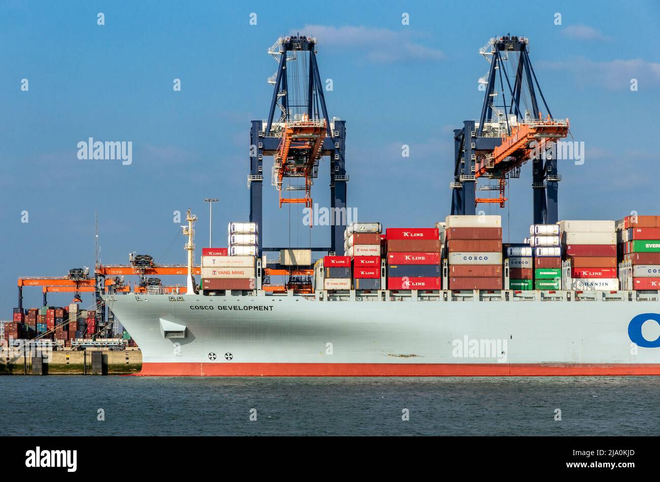 Crane operator unloading a sea container from a cargo ship the Port of Rotterdam. March 3, 2016 Stock Photo