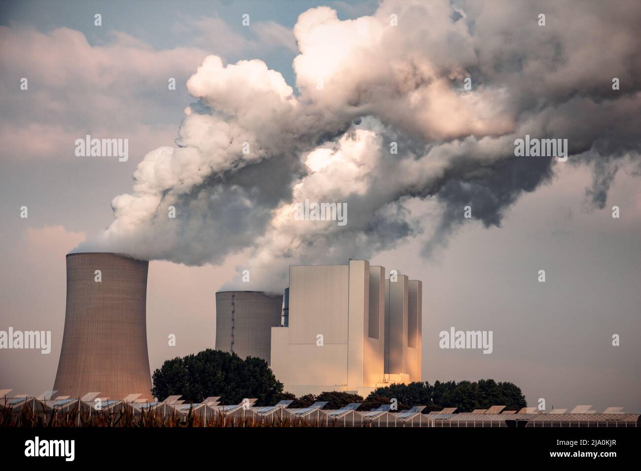 Power plant factory chimney emissions causing air pollution. Stock Photo