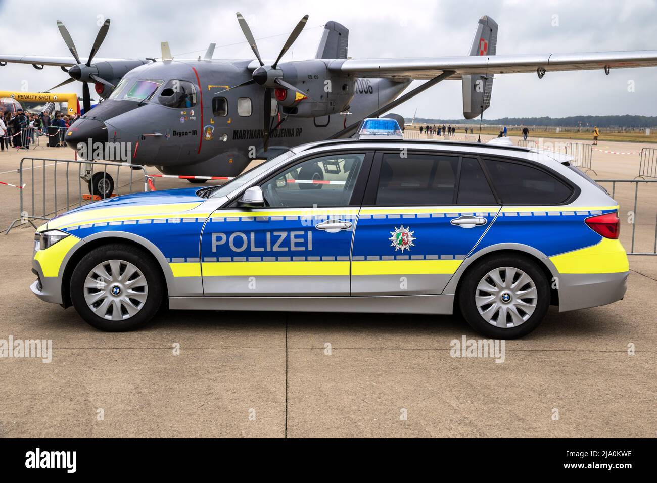 BMW 318d Touring of the German Police of Nordrhein-Westfalen in front of a Polish Navy M28 Skytruck at NATO base Geilenkirchen. Germany - July 2, 2017 Stock Photo