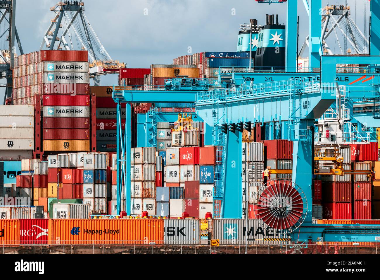 Shipping containers are moved in the APM Terminal in the new Maasvlakte 2 in the Port of Rotterdam. The Netherlands - September 8, 2019 Stock Photo