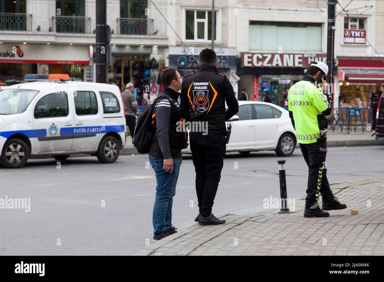 Istanbul, Turkey - May 09 2019: Two Tourism police officers next to a collegue from the Traffic police. Stock Photo