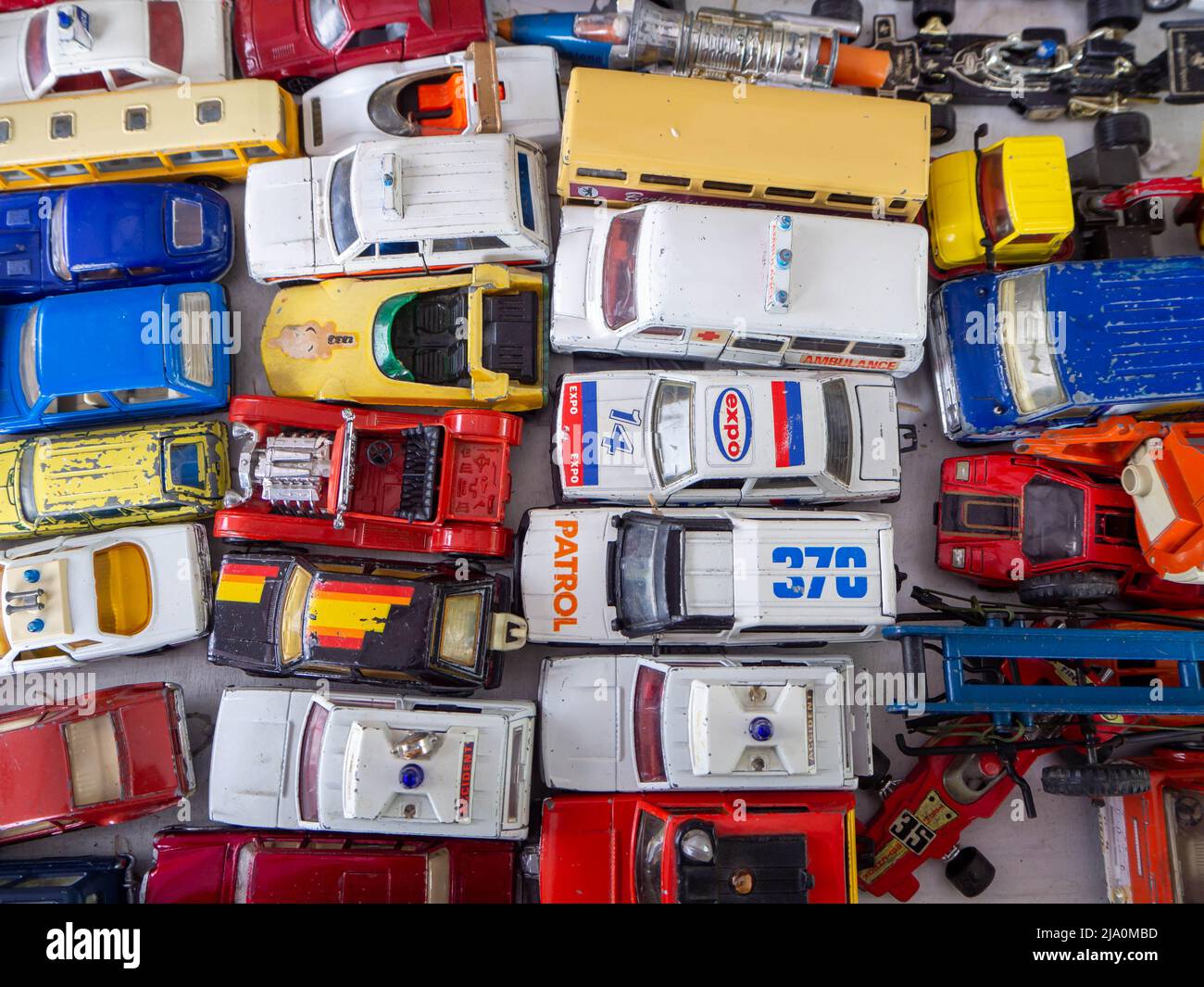 Selection of vintage collectable toy cars and vehicles laid out in columns and rows. Stock Photo